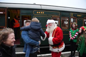 Santa with delighted family on the platform